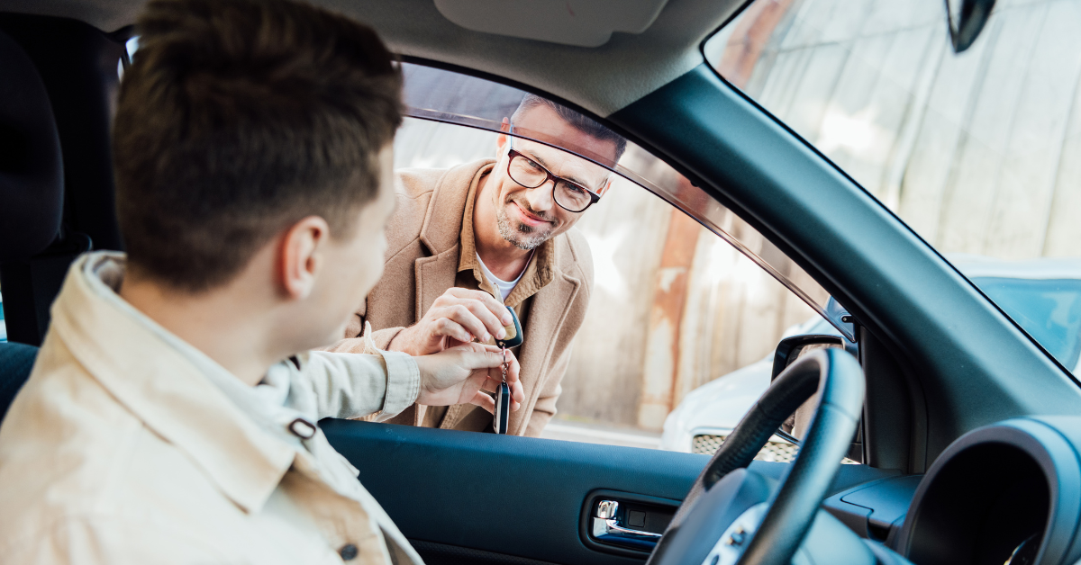 Teen in car talking to a man