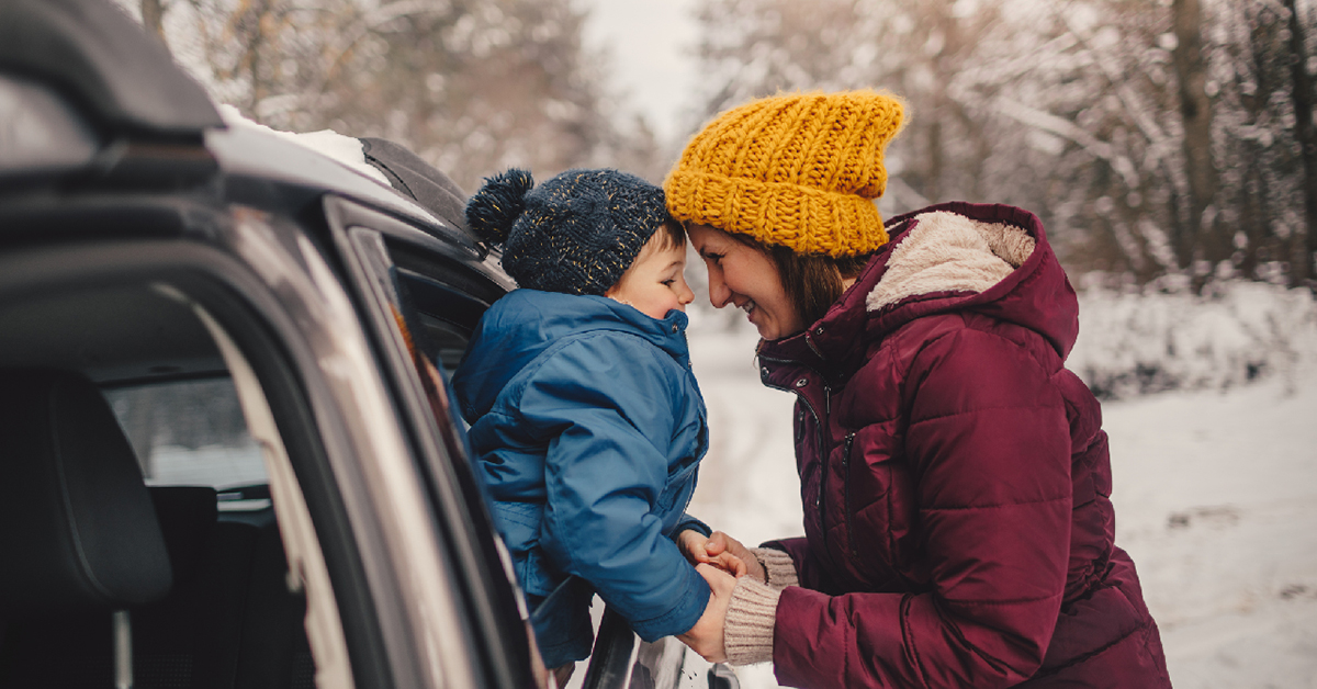 Mother and son on a winter road trip